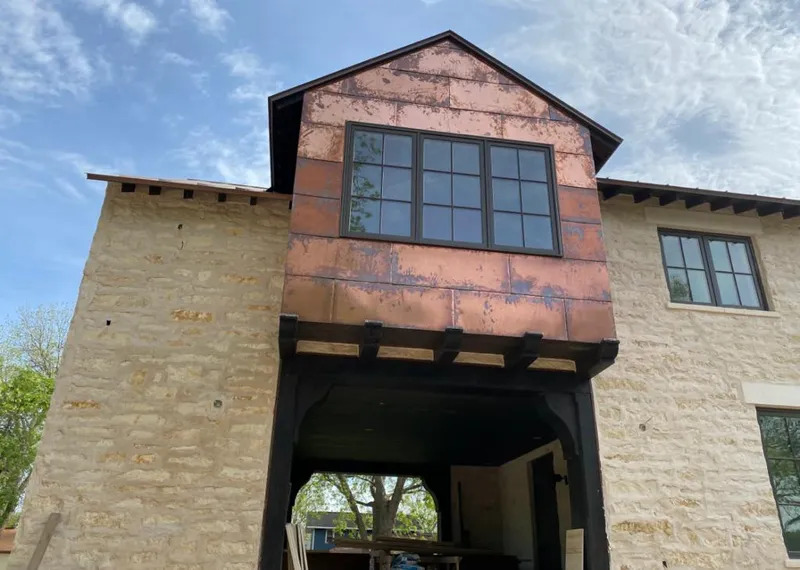 Copper metal panel facade on a stone building for Skylight Installation in Lake Elsinore