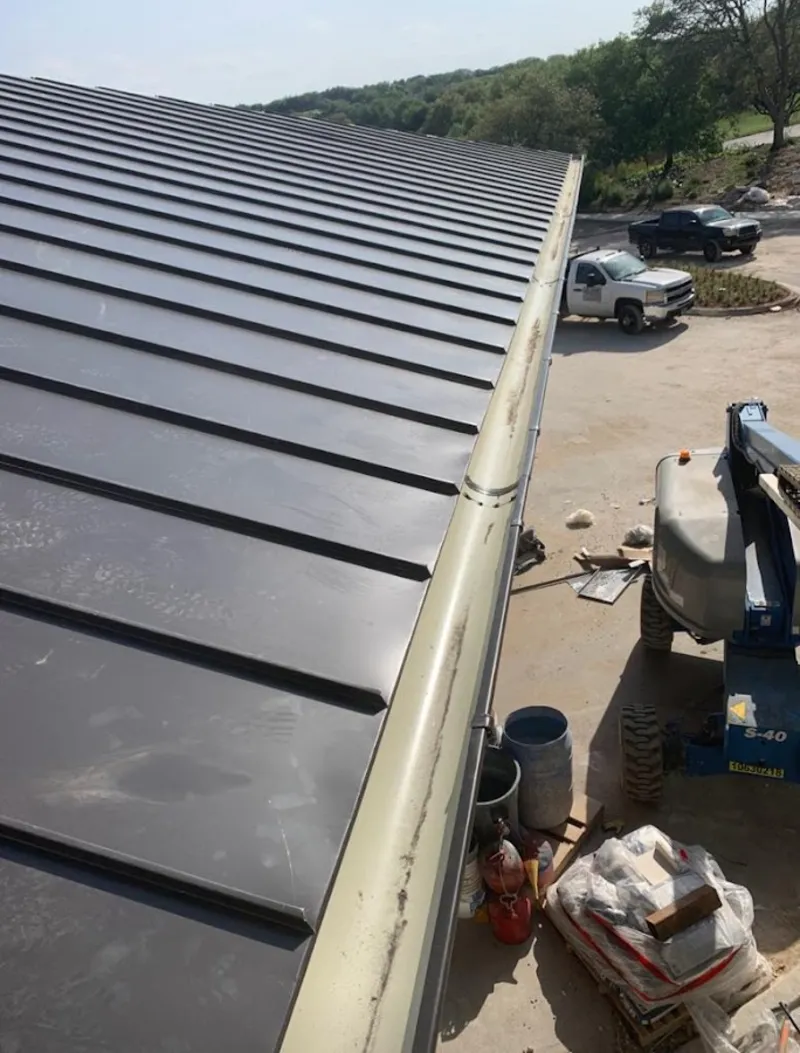 Standing seam panel and gutter detail on a metal roofing jobsite in Lake Elsinore